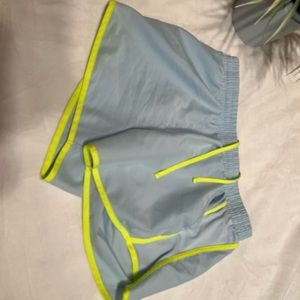 Under Armour running shorts with pockets.